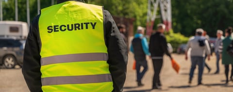 Security guard monitoring crowd at retail event